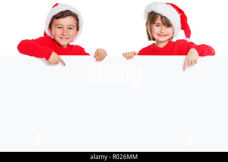 Christmas children kids Santa Claus pointing happy empty banner isolated on white copyspace copy space young Stock Photo