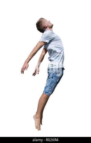 Side view full length portrait of casual young man jumping free isolated over white background. Freedom concept flying boy. Stock Photo