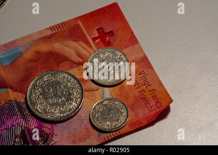 swiss franc coins on white background Stock Photo