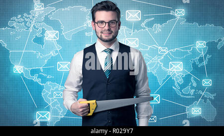 Businessman holding tool with global map graphic on the background Stock Photo