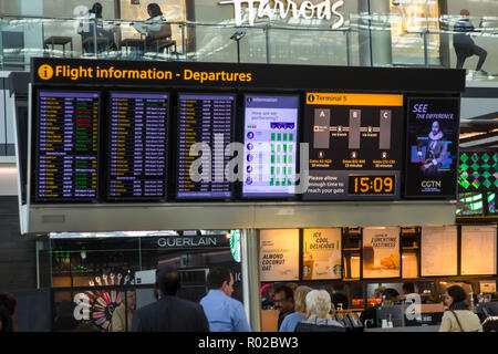 2 May 2018 A large flight information digital display board at Terminal 5 departures in Heathrow Airport England, This busy airport is one of the larg Stock Photo