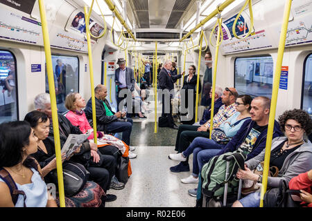 London England,UK,Lambeth South Bank,Waterloo Underground Station train Tube,subway tube,train,inside interior,carriage cabin,seats,sitting,man men ma Stock Photo