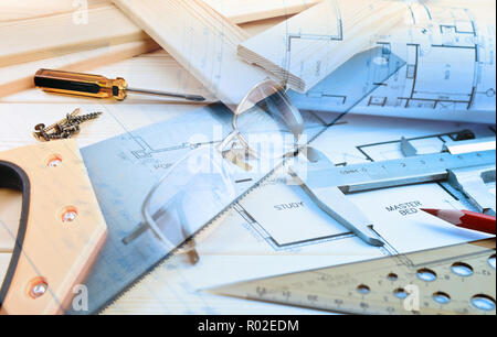 Assorted work tools and home design blueprints collage Stock Photo