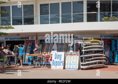 Manly, New South Wales,Australia-December 21,2016: Dripping Wet Surf Shop by Manly Beach with tourists and surfboards in Manly, Australia Stock Photo