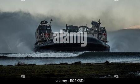 A US Navy Landing Craft Air Cushion (LCAC) hits the beach in Ålvund, Norway during Exercise Trident Juncture 2018. Trident Juncture 2018 gathered 50,000 personnel from 31 NATO Allies and partner nations in central Norway.    Photo by NATO Stock Photo