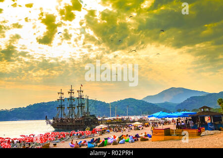 Fethiye, Mugla/Turkey - August 19 2018: People enjoying Belcekiz Beach in Oludeniz in the sunset Stock Photo