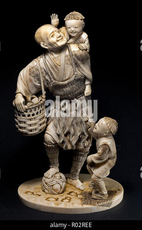 Ivory japanese okimono on black background Stock Photo