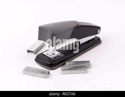 black Stapler with staples wires on white background. Stock Photo