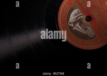 Old retro 12' gramophone 78 rpm record like black vinyl from brittle material shellac resin phonograph disc or records what goes around comes around Stock Photo