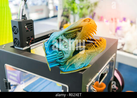 3D printer printing dragon head figure close-up. Stock Photo