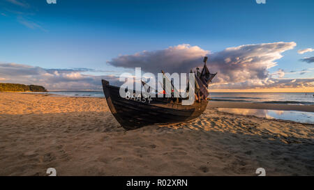 Old fishing boat at the beach on the island of Rügen, Germany | Altes Fischerboot am Strand auf derr Insel Rügen Stock Photo