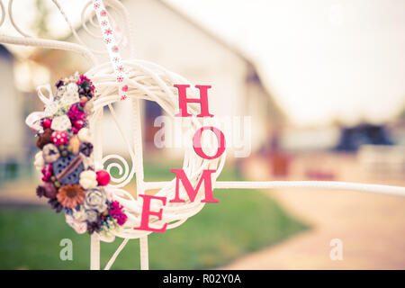 Home decoration ideas. Xmas sign. Wooden wreath with cozy home decoration elements. Interior design elements, seasonal Christmas decoration for home Stock Photo