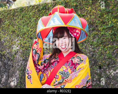 Okinawa / Japan - October 9, 2018: “Hanagasa” is one of the best known symbols of Okinawa and a very popular stage prop in Okinawan traditional dance. Stock Photo