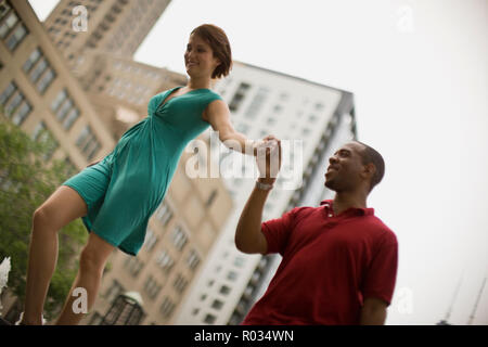 Young man holding his girlfriend's hand. Stock Photo