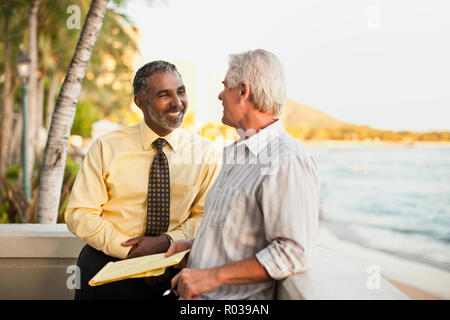 Two business colleagues laughing together. Stock Photo