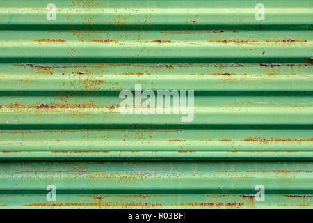 Old rusty metal ribbed surface painted in green color Stock Photo
