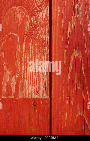 Fragment of painted in red old wooden shield Stock Photo