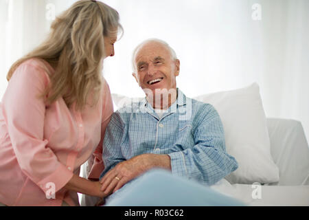 Smiling mature woman laughing with her senior husband. Stock Photo