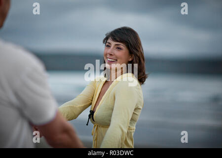 Happy middle aged couple spending time together at the beach. Stock Photo