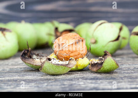 broken walnuts during a meal, lie on the table Stock Photo