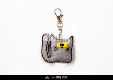 Felt Keychain in shape kitten. Handmade jewelry. Stock Photo