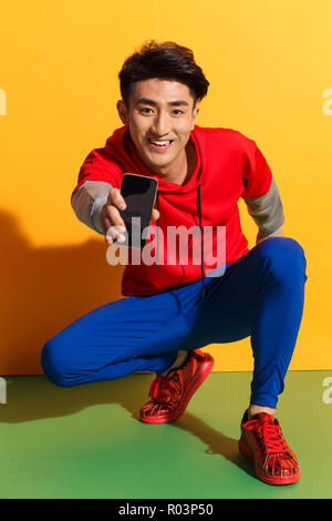 Young men with mobile phone Stock Photo
