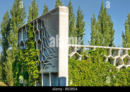 Utrecht, The Netherlands, September 27, 2018: section of the concrete and partly overgrown park pergola in Maximapark Stock Photo