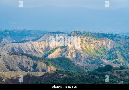 The famous Civita di Bagnoregio hit by the sun on a stormy day. Province of Viterbo, Lazio, Italy. Stock Photo