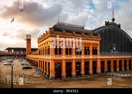 Madrid, Spain - October 27, 2018:  Exterior view of old Atocha Railway Station at sunrise. Stock Photo