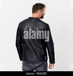 Back view of man with beard wearing black clothes, isolated Stock Photo