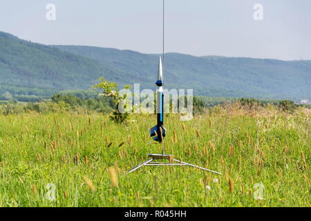 Rocket model prepare for takeoff launch, summer sunny day Stock Photo