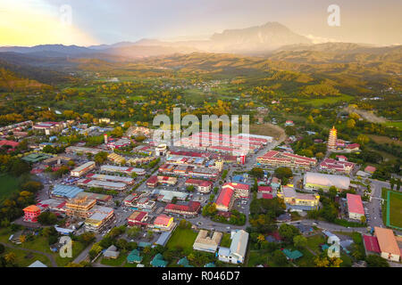 Small town in Sabah Malaysia Borneo with Mount Kinabalu at far background. Stock Photo