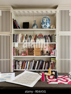 Bookcase in sewing room Stock Photo