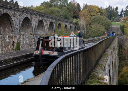 A couple enjoy a boating trip on the Llangollen Canal as it passes over Chirk Aqueduct, Wales, UK Stock Photo