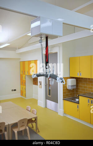 Close-up of a rail-mounted disabled hoist in a brand new special school for children with severe learning difficulties, Southwark, London, UK Stock Photo