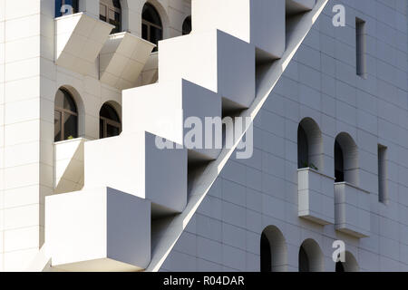 Mixing of forms and shapes, layering in modern architecture - part of facade building, unusual geometrical exterior, complex structure. Stock Photo