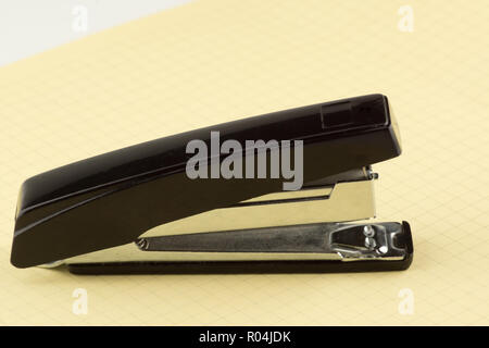 new stapler for stapling papers on a table Stock Photo