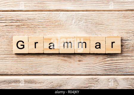 grammar word written on wood block. grammar text on table, concept. Stock Photo