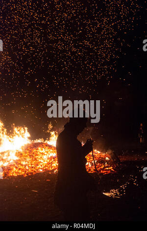 Members of the Ewhurst & Staplecross Bonfire Society celebrate their annual historical fireworks, on 27th October 2018, in Staplecross, England UK. The society hosts the annual village bonfire celebrations and raises money throughout the year for local charities and good causes. The Sussex Bonfire Societies are responsible for the series of bonfire festivals concentrated on central and eastern Sussex, with further festivals in parts of Surrey and Kent from September to November each year. The celebrations mark both Guy Fawkes Night and the burning of 17 Protestant martyrs in Lewes's High Stree Stock Photo