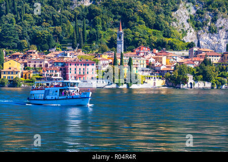 People on boat trip around the village of Varenna, Lake Como, Lecco province, Lombardy, Italian Lakes, Italy, Europe