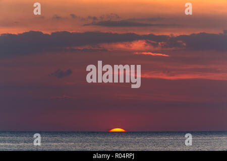 Sunset on tropical sea , last moment of the sun and the day, Thailand Stock Photo