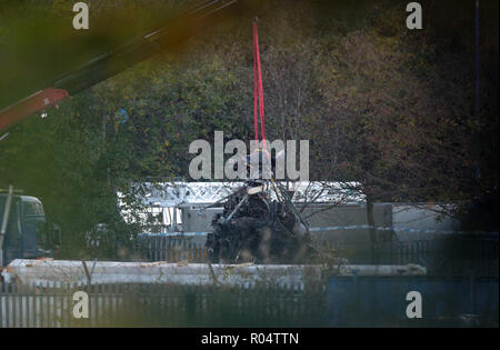 A crane moves part of the wreckage from the helicopter crash at Leicester City Football Club. Stock Photo