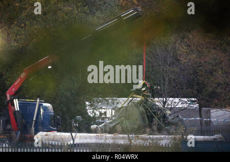 A crane moves part of the wreckage from the helicopter crash at Leicester City Football Club. Stock Photo