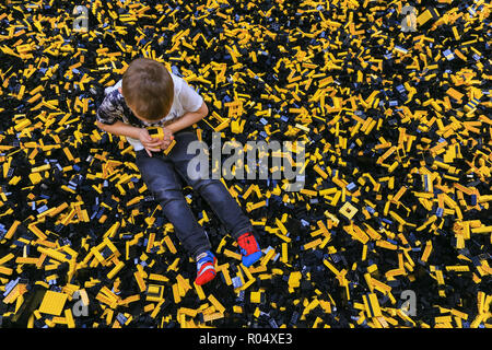 A little boy playing with lego bricks Stock Photo