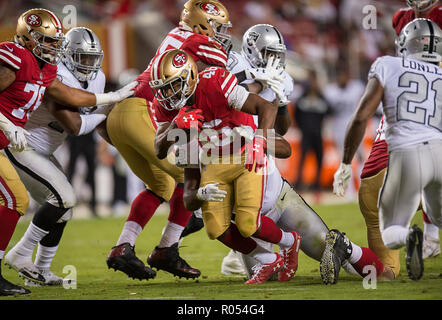 Santa Clara, CA, USA. 1st Nov, 2018. San Francisco 49ers fullback Kyle  Juszczyk (44) is tackled by Oakland Raiders middle linebacker Marquel Lee  (55) in the first quarter during a game at