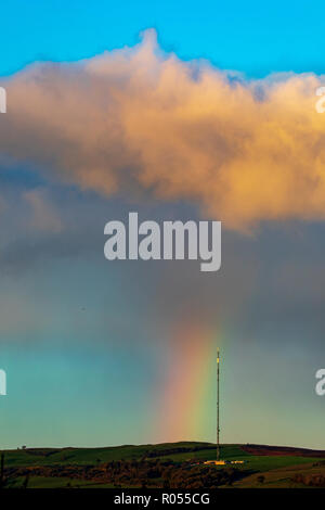 Flintshire, North Wales, 2nd November 2018. UK Weather: Cold conditions this morning with a little frost for some. A passing shower over the Clwydian Range leaves a rainbow as the cloud passes of the telecommunications mast on Moel-y-Parc Â© DGDImages/AlamyLiveNews Stock Photo
