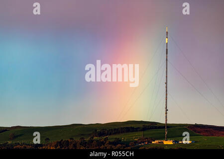 Flintshire, North Wales, 2nd November 2018. UK Weather: Cold conditions this morning with a little frost for some. A passing shower over the Clwydian Range leaves a rainbow as the cloud passes of the telecommunications mast on Moel-y-Parc Â© DGDImages/AlamyLiveNews Stock Photo