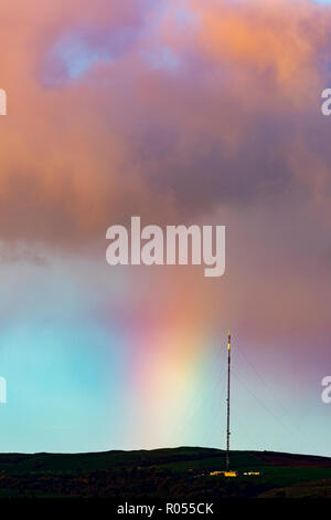 Flintshire, North Wales, 2nd November 2018. UK Weather: Cold conditions this morning with a little frost for some. A passing shower over the Clwydian Range leaves a rainbow as the cloud passes of the telecommunications mast on Moel-y-Parc Â© DGDImages/AlamyLiveNews Stock Photo