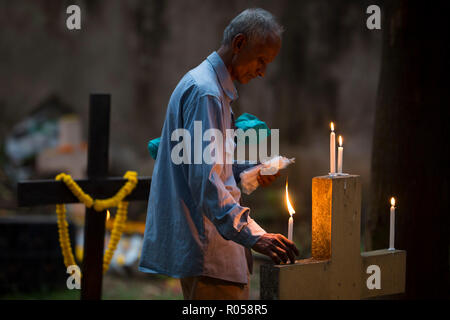 Dhaka, Bangladesh. 2nd Nov 2018.  Christian devotees observe All Souls' Day, known as the Feast of All Souls, Commemoration of all the Faithful Departed in Dhaka , Bangladesh on November 02, 2018.  On this day, Christians come to the graveyard and pray for the departed souls of their loved ones..All Soul's Day is a Roman Catholic day of remembrance for friends and loved ones who have passed away. Credit: zakir hossain chowdhury zakir/Alamy Live News Stock Photo