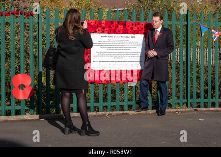 Poppy Road 1st to 11th November, 2018. Andy Street, Mayor of West Midlands is interviewed in front of a remembrance tribute from one generation to another, Aldridge, Walsall, UK Stock Photo